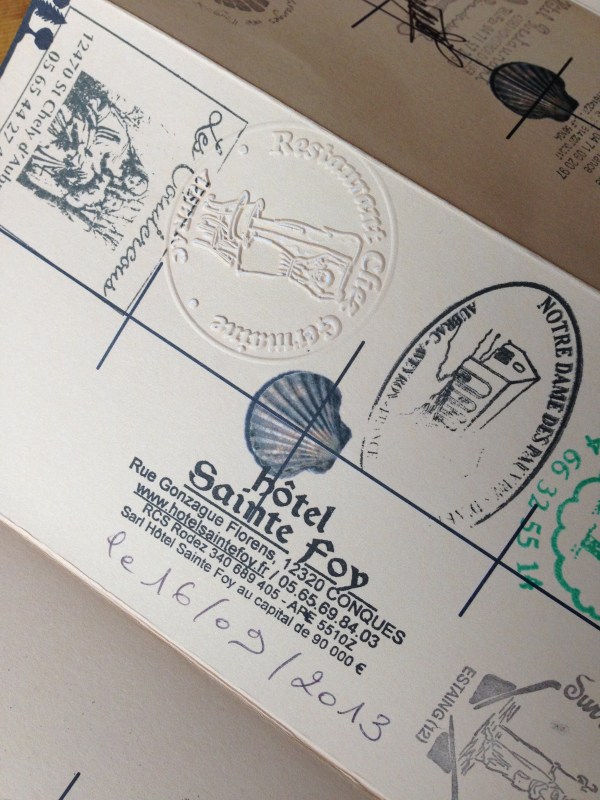 My Camino de Santiago ~ Via Podiensis pilgrimage passport, with stamps from along our route.